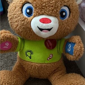 Interactive Plush Bear with Green Shirt and Colorful Accents